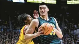  ?? MICHAEL CONROY/AP ?? Purdue center Zach Edey, right, scored 24 points and grabbed 16 rebounds in a 58-55 win over Maryland on Jan. 22.