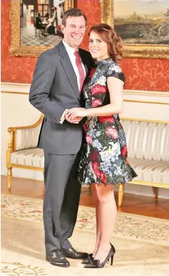  ??  ?? Princess Eugenie poses with her fiance Brooksbank at Buckingham Palace in London last Jan 22, after the announceme­nt of their engagement. — AFP file photo