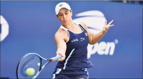  ?? Angela Weiss / TNS ?? Ashleigh Barty hits a return to Clara Tauson during the second round at the U.S. Open on Thursday.