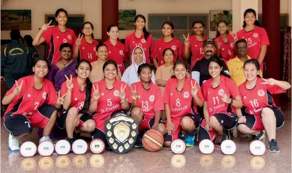  ??  ?? Players of the St Francis College (Begumpet) basketball team are all smiles after winning the Osmania University inter-college tournament conducted at their college courts in Hyderabad.