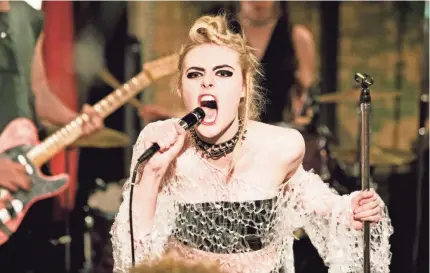  ?? DEAN ROGERS/A24 ?? Elle Fanning says punk was alien to her before she started filming “How to Talk to Girls at Parties.”