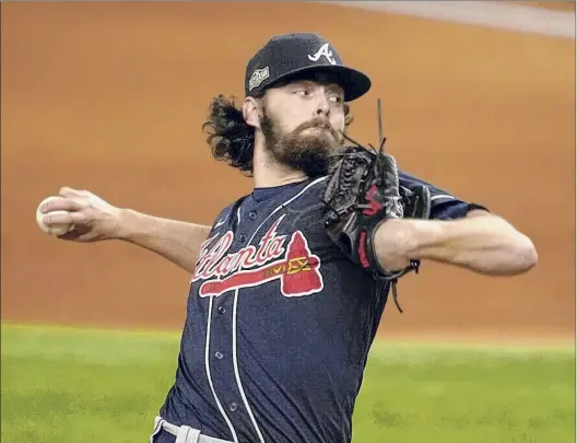  ?? Tony Gutierrez / Associated Press ?? Shenendeho­wa graduate Ian Anderson gained invaluable experience in the postseason, including Game 7 of the NLCS vs. the Dodgers.