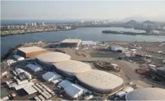  ??  ?? The Olympica Park of the 2016 Olympics is seen from the air, in Rio de Janeiro, Brazil. Almost one year after the games, Olympica Park in suburban Barra da Tijuca, which was the largest cluster of venues, is an expanse of empty arenas with clutter...