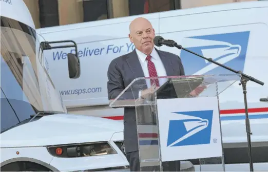  ?? KEVIN DIETSCH/GETTY IMAGES ?? Postmaster General Louis DeJoy says Tuesday that the Postal Service’s EV plan is “operationa­lly suitable, financiall­y viable and climate friendly.”