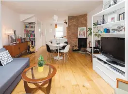  ??  ?? The open-plan living room, dining area and kitchen and, left, the property is a smart redbrick terrace