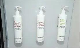  ?? DAN HUFF THE ASSOCIATED PRESS ?? Marriott Internatio­nal, the world's largest hotel chain, said Wednesday it will replace small plastic bottles of shampoo with larger bottles or wall-mounted dispensers like these.