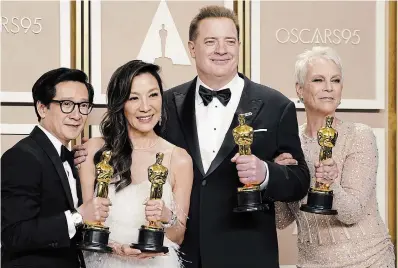  ?? JORDAN STRAUSS INVISION ?? Ke Huy Quan, left, Michelle Yeoh, Brendan Fraser and Jamie Lee Curtis pose with their awards.