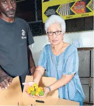  ??  ?? Carita Limited CEO Rita Hilton and an unidentifi­ed employee show off produce exported by the company in this august 2017 file photo. Carita will be relocating its operations to newly acquired premises in Kingston in February and is making plans to...