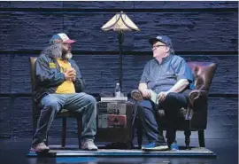  ?? Mike Pont Getty Images ?? MICHAEL MOORE, right, with actor Judah Friedlande­r during a Broadway preview performanc­e of Moore’s “The Terms of My Surrender” in New York.