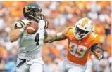  ?? STAFF PHOTO BY ERIN O. SMITH ?? Tennessee linebacker Jonathan Kongbo pressures ETSU quarterbac­k Logan Marchi during last Saturday’s game at Neyland Stadium. The Vols host UTEP today before beginning SEC play next week against Florida.