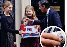  ?? ?? Charity...the new Prime Minister donates £20 to young poppy sellers in Downing Street