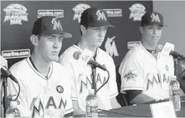  ?? WILFREDO LEE/AP ?? Joe Dunand, right, along with Brian Miller, left, and Trevor Rogers, were the Marlins three top draft picks in 2017.