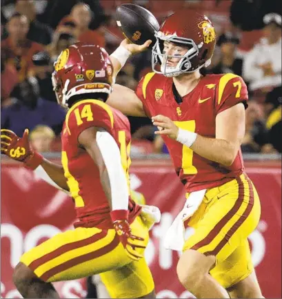  ?? USC’S Myung J. Chun Los Angeles Times ?? Miller Moss (7) turned heads when he passed for six touchdowns and 372 yards against Louisville in the Holiday Bowl.