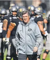  ?? RON CHENOY, USA TODAY SPORTS ?? “We don’t want to get to this point and say, ‘ Whew, we made it.’ We’ll be passed by in a heartbeat,” Mike MacIntyre says.