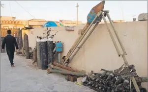  ?? CP PHOTO ?? A cache of weapons captured from ISIS is seen at the regional Pechmerga headquarte­rs on Thursday in Bashiqa, Iraq. The town in the Mosul district was liberated last November after being under ISIS control for two years.