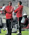  ?? | SYDNEY MAHLANGU BackpagePi­x ?? ORLANDO Pirates co-coach Mandla Ncikazi chats with colleague Fadlu Davids during their team’s 0-0 draw with Chippa United on Wednesday.