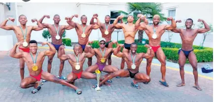  ?? ?? Sabelo Maxwell ‘Bulldozer’ Nxumalo and his bodybuildi­ng team with their awards at the IFBB National Championsh­ips