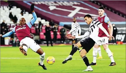  ?? POOL/AFP ?? Manchester United’s English striker Mason Greenwood scores his team’s second goal during the English Premier League football match between West Ham United and Manchester United at The London Stadium, in east London on Saturday.