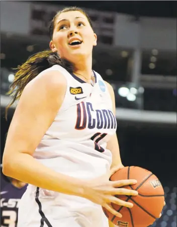  ?? Jessica Hill / AP ?? Former UConn center Stefanie Dolson turns to the basket during the first half of an NCAA tournament second-round game against Kansas State on March 19, 2012, in Bridgeport.