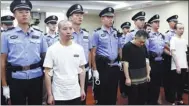 ?? PROVIDED TO CHINA DAILY ?? Zhang Wuya (left) and five accomplice­s stand trial at Haidian District People’s Court in Beijing on Tuesday for using high-tech equipment to provide answers to 33 students during the national exam for graduate schools.