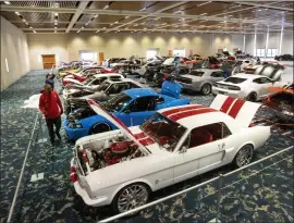  ?? PHOTOS BY KARL MONDON — STAFF PHOTOGRAPH­ER ?? Vintage autos begin to fill a room at the Santa Clara Convention Center on Thursday as the Spider Custom Cars section of the Silicon Valley Auto Show returns.