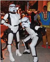  ??  ?? This file photo taken on October 29, 2016 shows people in costume in the Georgetown neighborho­od of Washington, DC for Halloween celebratio­ns. — AFP