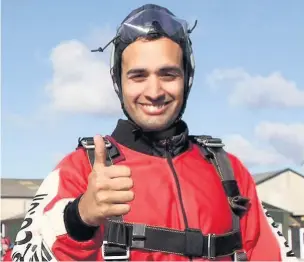  ??  ?? Policeman Zak Khan faced his fear of heights to tackle his first skydive to raise money for The Children’s Society