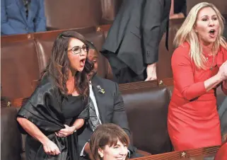  ?? EVELYN HOCKSTEIN/POOL VIA AP ?? Rep. Lauren Boebert, R-Colo., left, and Rep. Marjorie Taylor Greene, R-Ga., scream “Build the Wall” as President Joe Biden delivers his first State of the Union address to a joint session of Congress at the Capitol on March 1.