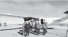  ?? KEVIN BISSETT THE CANADIAN PRESS ?? Department of Fisheries and Oceans observers prepare to board an aircraft for a monitoring flight in Moncton, N.B. on Wednesday.