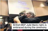  ??  ?? British MEP Julie Ward, right, is embraced during the ceremony