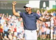  ?? Sam Greenwood / Getty Images ?? Jason Day reacts following his par putt on the 18th green during the final round to win the Wells Fargo Championsh­ip at Quail Hollow Club on Sunday.