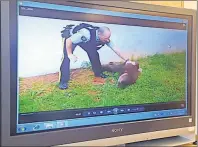  ?? GUARDIAN IMAGE ?? A screenshot from video taken outside Joel Lawrence Clow’s home in Pleasant Grove on July 24, 2015 shows the accused on the ground as RCMP Const. Robert Honkoop tries to reassure him he will be OK.