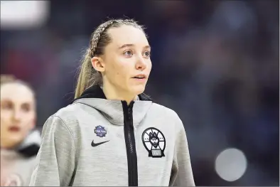  ?? Elsa / Getty Images ?? Paige Bueckers of the UConn Huskies warms up prior to the first quarter against the Arizona Wildcats in the Final Four semifinal game of the 2021 NCAA Women's Basketball Tournament at the Alamodome on April 2 in San Antonio, Texas.