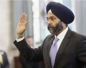  ?? Chris Pedota/The Record via AP ?? In this Jan. 16, 2018, photo, Gurbir Grewal is sworn in before testifying in front of the state Senate Judiciary Committee in Trenton, N.J.