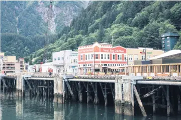  ?? MEG ROUSSOS Bloomberg ?? Boat slips stand empty at a dock in Juneau, Alaska, in 2020.