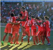  ??  ?? Aizawl FC players celebrate their 2- 1 win over Minerva Punjab in their I- League match in Aizawl on Wednesday.
