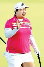  ?? — AFP photo ?? Shanshan Feng of China celebrates after her final putt on the 18th green during the U.S.Women's Open round three on July 15, 2017 at Trump National Golf Club in Bedminster, New Jersey.