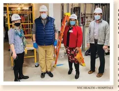  ?? NYC HEALTH + HOSPITALS ?? Christine Flaherty, left, and her team walk through the new 120-bed ICU space constructe­d at NYC Health + Hospitals/North Central Bronx during the first surge.