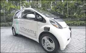  ?? YONG TECK LIM / AP ?? An autonomous vehicle is parked for its test drive in Singapore. NuTonomy plans a test pilot program in Boston in the coming months.