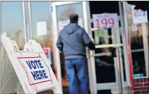  ??  ?? Voters cast their ballots in Oklahoma City election at Crown Heights Christian Church on Tuesday.