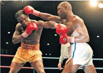  ??  ?? Role model: Chris Eubank Snr (left) in action against Nigel Benn at Old Trafford in 1993