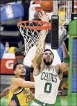  ?? Elise Amendola / Associated Press ?? Boston forward Jayson Tatum drives to the basket past Indiana guard Jeremy Lamb. Tatum had 9 points.