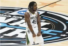  ?? Darron Cummings / Associated Press ?? Guard Davion Mitchell and Baylor were dominant in the Final Four, beating Houston and Gonzaga by a combined 35 points.
