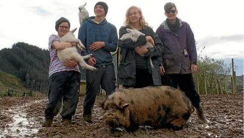  ??  ?? From left: Manon Gren, Anatole Radi, Malin Anderson and Coces Vehreschil­d with, from left, Enzo, cockatoo Casper, Winky the lamb and Larry the pig.