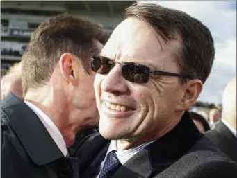  ??  ?? Aidan O’Brien is congratula­ted after his world record-breaking feats in Doncaster on Saturday.