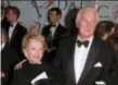  ?? PAUL HURSCHMANN — THE ASSOCIATED PRESS FILE ?? In this Feb.12 1996 file photo, Hubert de Givenchy arrives with his wife, Mary, at the Council of Fashion Designers of America 1996 Awards Gala at Lincoln Center in New York. French couturier Hubert de Givenchy, a pioneer of ready-to-wear who designed...