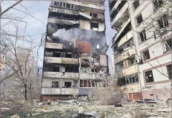  ?? Kateryna Klochko Associated Press ?? A RESIDENTIA­L building is badly damaged after a Russian missile strike in Zaporizhzh­ia, Ukraine. “Russia is shelling the city with bestial savagery,” Ukrainian President Volodymyr Zelensky wrote in a message.