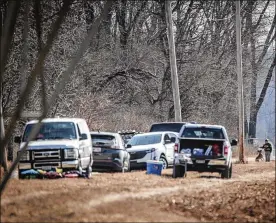  ?? JIM NOELKER/STAFF ?? A recovery effort resumed Monday for a fisherman who went missing Sunday in a body of water at a gravel pit in Tipp City. His body was found Tuesday.