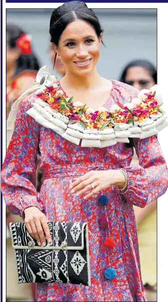  ??  ?? Meghan is relaxed as she and Harry visit the university in Fiji’s capital Suva