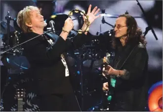  ?? The Associated Press ?? Inductee Jon Anderson from the band Yes, left, and Geddy Lee from the band Rush perform at the 2017 Rock and Roll Hall of Fame induction ceremony at the Barclays Center on Friday in New York.